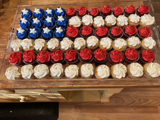 Rows of red, white, and blue celebration cupcakes